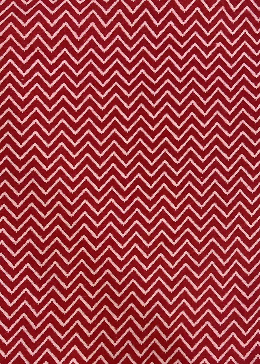 Red and white chevron pattern on a red background