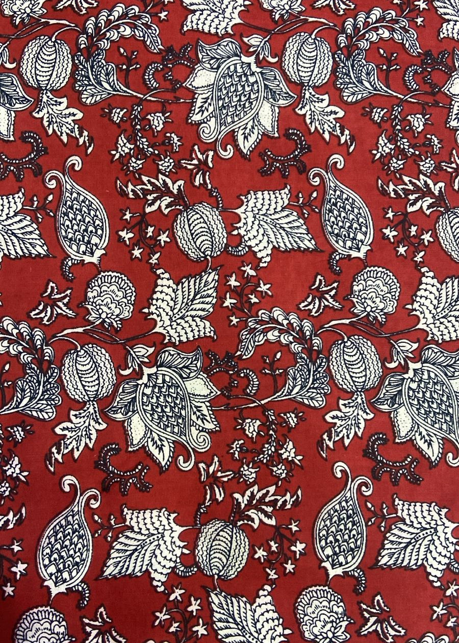 Red fabric with black and white floral pattern