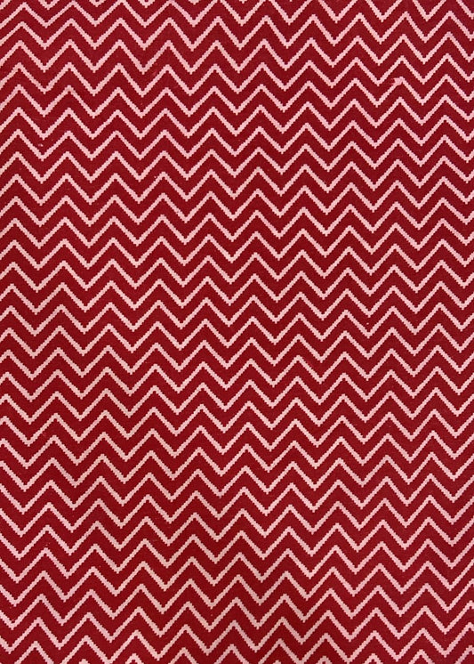 Red and white chevron pattern on a red background