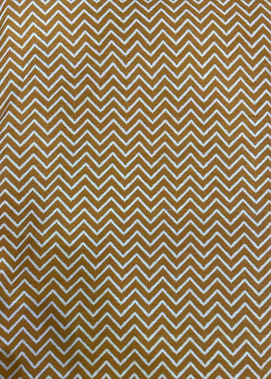 Pattern of chevron shapes in gold on a beige background