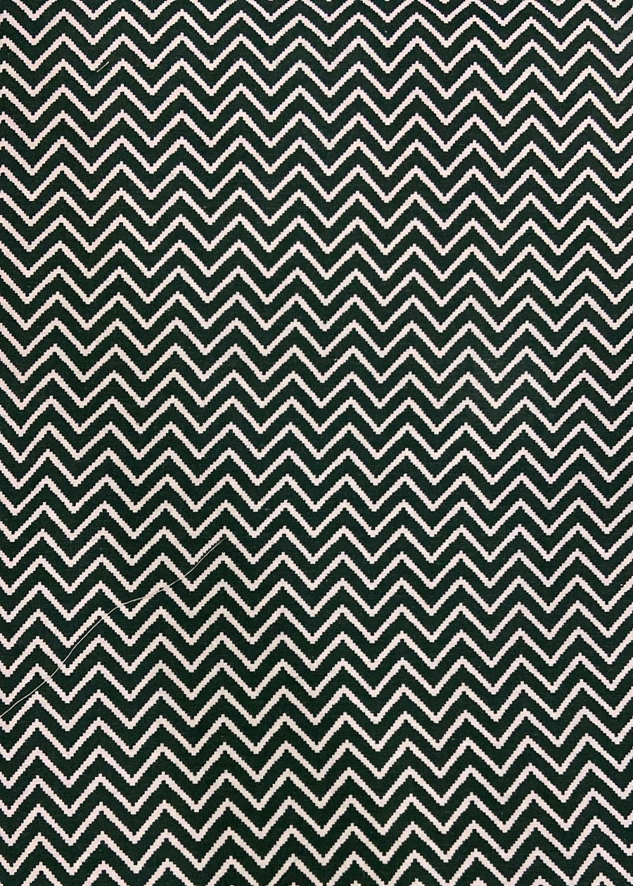 Pattern of greem and white chevron stripes on a textured background